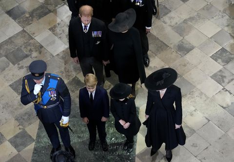 britain's prince william,, front left, and kate, princess of wales with their children princess charlotte of wales, prince george of wales, britain's prince harry, rear left, and his wife meghan, the duchess of sussex, follow the coffin of queen elizabeth ii as it is carried out of westminster abbey during her funeral in central london, monday, sept 19, 2022 the queen, who died aged 96 on sept 8, will be buried at windsor alongside her late husband, prince philip, who died last year ap photofrank augstein, pool