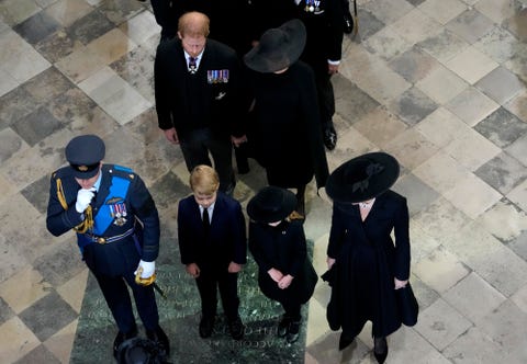 britain's prince william,, front left, and kate, princess of wales with their children princess charlotte of wales, prince george of wales, britain's prince harry, rear left, and his wife meghan, the duchess of sussex, follow the coffin of queen elizabeth ii as it is carried out of westminster abbey during her funeral in central london, monday, sept 19, 2022 the queen, who died aged 96 on sept 8, will be buried at windsor alongside her late husband, prince philip, who died last year ap photofrank augstein, pool