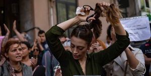 nasibe samsaei, an iranian woman living in turkey, cuts her ponytail off during a protest outside the iranian consulate in istanbul on september 21, 2022, following the death of an iranian woman after her arrest by the countrys morality police in tehran   mahsa amini, 22, was on a visit with her family to the iranian capital tehran, when she was detained on september 13, 2022, by the police unit responsible for enforcing irans strict dress code for women, including the wearing of the headscarf in public she was declared dead on september 16, 2022 by state television after having spent three days in a coma photo by yasin akgul  afp photo by yasin akgulafp via getty images