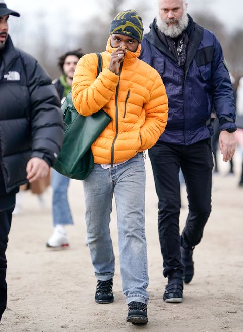 paris, france   january 17 frank ocean wears an orange puffer jacket, a beanie hat from arcteryx, outside louis vuitton, during paris fashion week   menswear fw 2019 2020,  on january 17, 2019 in paris, france photo by edward berthelotgetty images