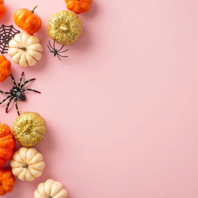 Trendsetting Halloween composition. Top view photo featuring tiny orange and golden sparkle pumpkins, eerie spiders, centipede, spiderweb, bat on soft pink surface. Great for messages or marketing trendsetting halloween composition top view photo featuring tiny orange and golden sparkle pumpkins, eerie spiders, centipede, spiderweb, bat on soft pink surface great for messages or marketing