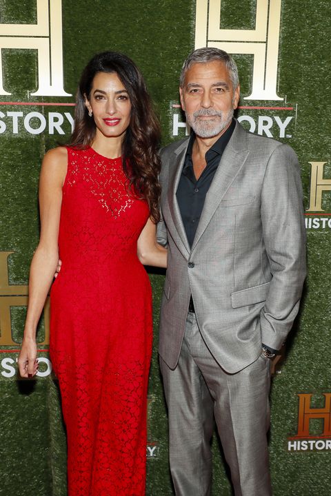Amal Clooney Wears Red Lace Column Gown With George to HISTORYTalks 2022 Event