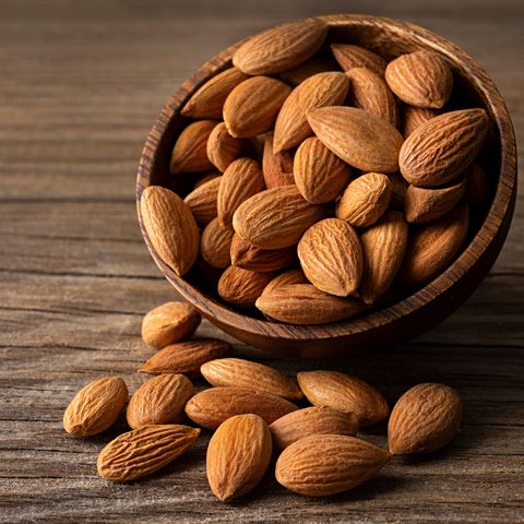 Bitter almonds in a wooden bowl
