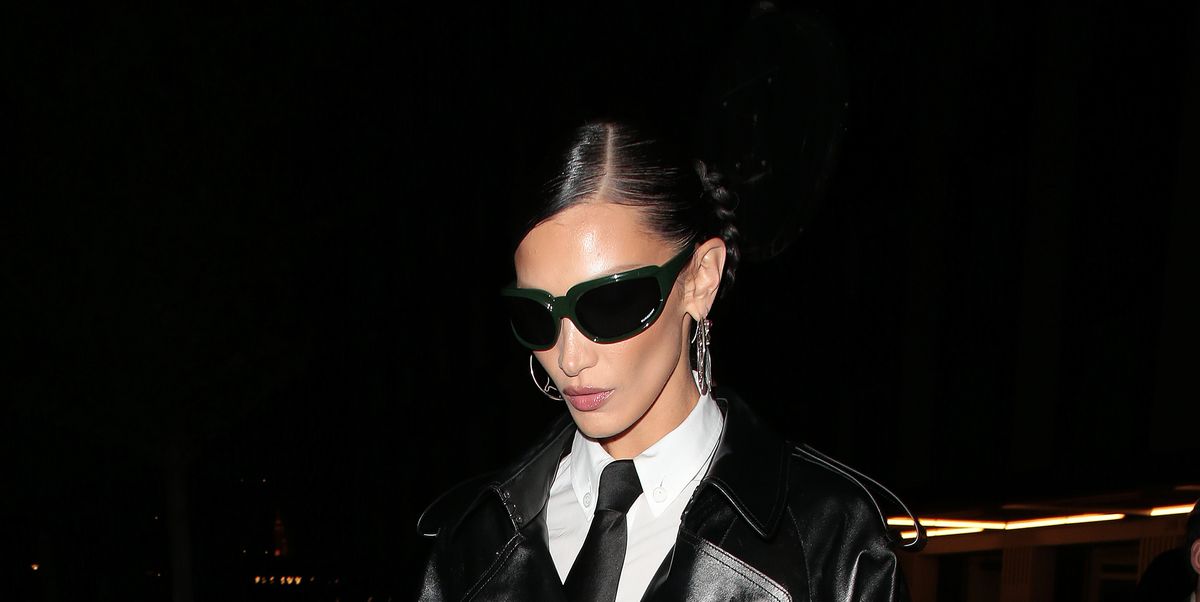 Bella Hadid Pairs Her Matrix-esque Trench Coat with an Unexpected Accessory