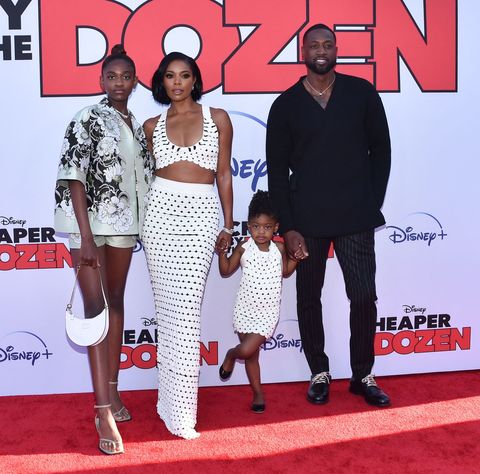 us actress gabrielle union 2l and her husband former professional basketball player dwayne wade pose with daughters zaya wade l and kaavia james union wade 2r as they arrive for the "cheaper by the dozen" disney premiere at the el capitan theatre in hollywood, california, march 16, 2022 photo by chris delmas  afp photo by chris delmasafp via getty images
