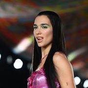 british singer and model dua lipa presents a creation for versaces womens spring summer 2022 collection during the fashion week in milan on september 24, 2021 photo by marco bertorello  afp photo by marco bertorelloafp via getty images