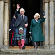 dunfermline, scotland   october 03 king charles iii and camilla, queen consort waves as they leave dunfermline abbey, after a visit to mark its 950th anniversary, and after attending a meeting at the city chambers in dunfermline where the king formally marked the conferral of city status on the former town on october 3, 2022 in dunfermline, scotland  photo by  andrew milligan   poolgetty images