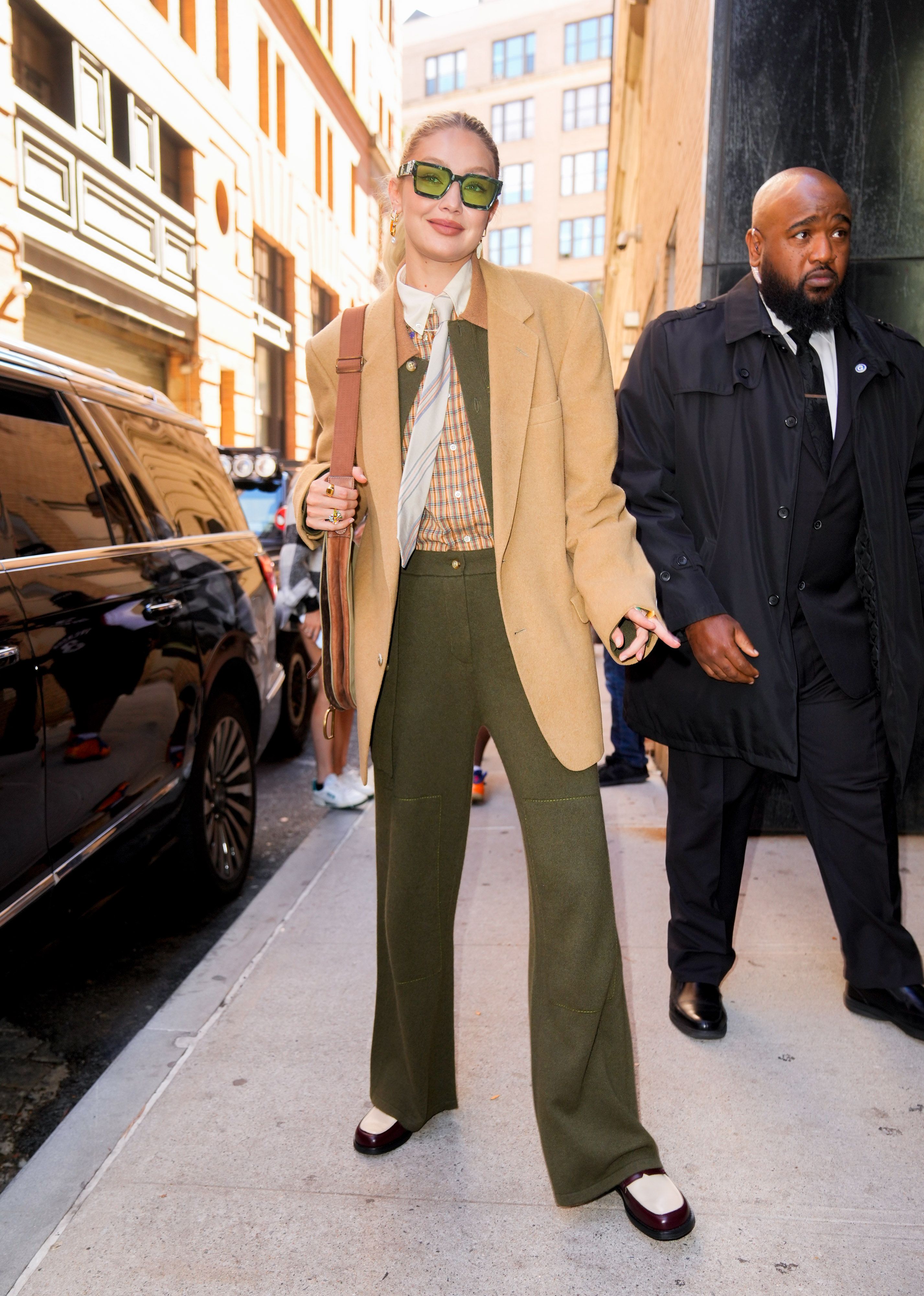 gigi hadid looks fashionable in a white vest with matching trousers while  stepping out in new york city-070921_9