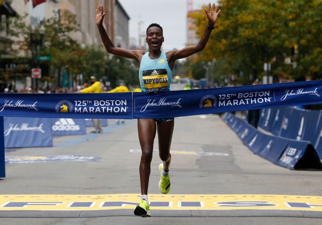 boston   october 11 womens racer diana kipyokei, of kenya crosses the finish line to win the 125th boston marathon in boston on oct 11, 2021 photo by jessica rinaldithe boston globe via getty images