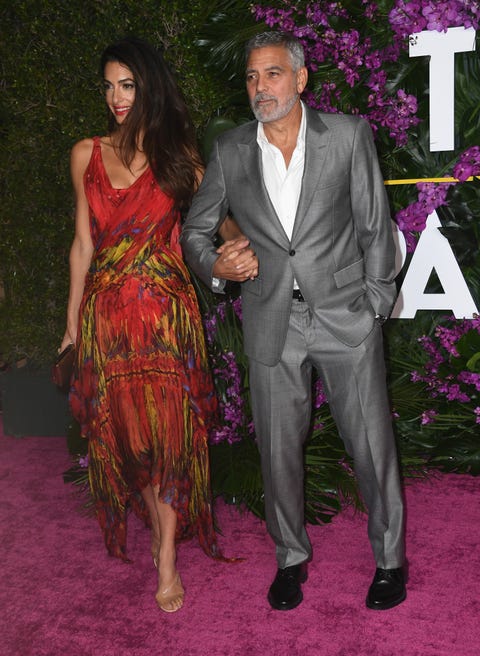 george and amal clooney holding hands