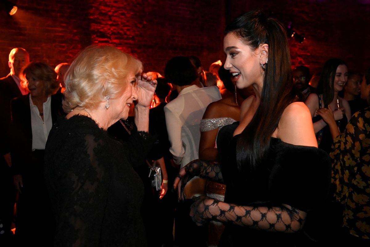 london, england   october 17 camilla, queen consort meets singer dua lipa at the 2022 booker prize for fiction ceremony at the roundhouse, on october 17, 2022, in london, england photo by toby melville   wpa poolgetty images