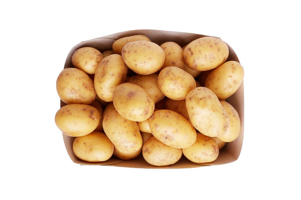 potatoes in paper box isolated in white background