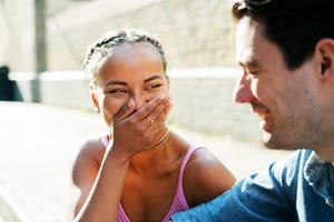 two friends talking and laughing