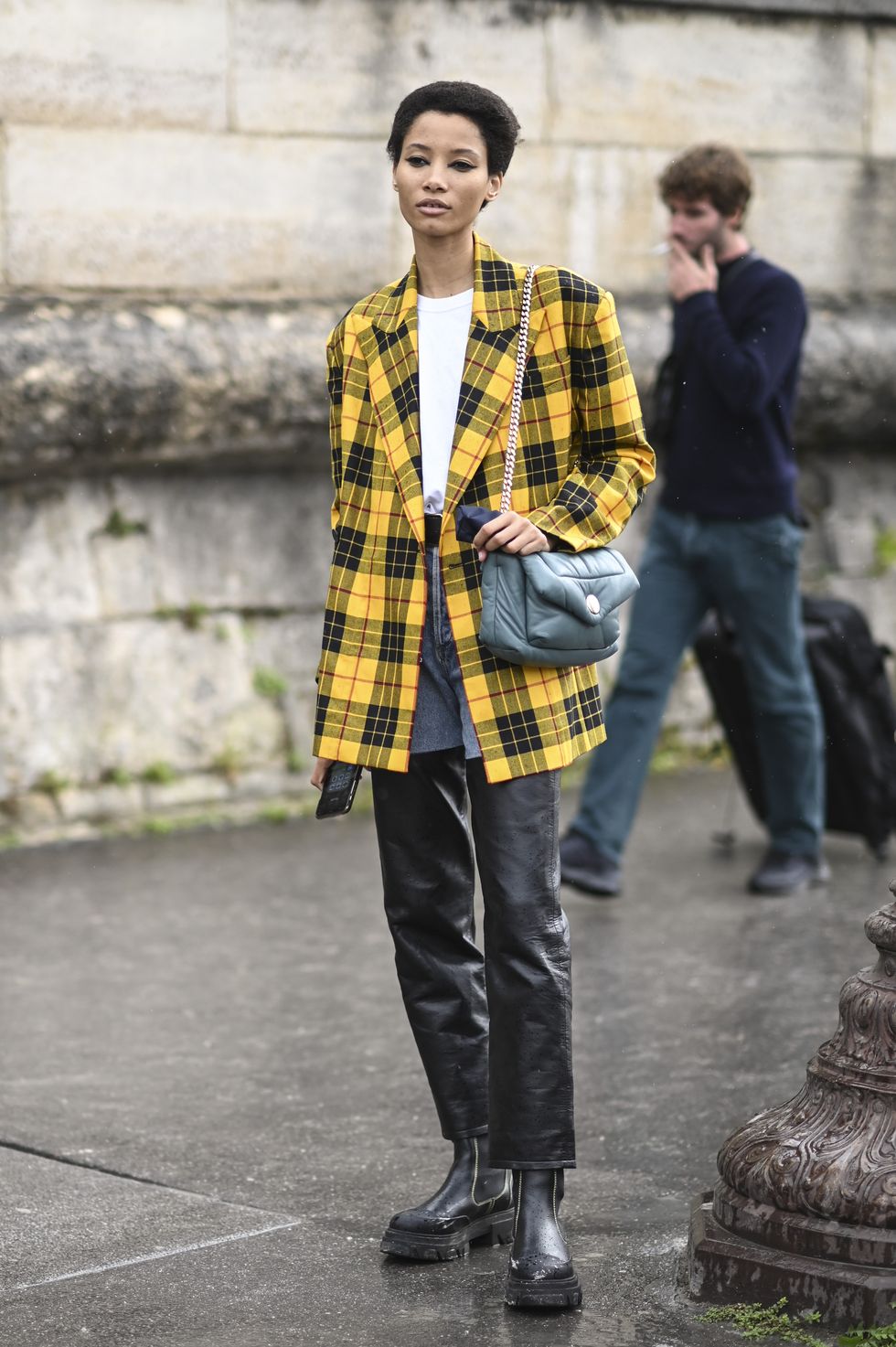 paris, france   september 27 model lineisy montero is seen wearing a yellow plaid jacket, black pants and green bag outside the dior show during paris fashion week ss 2023 on september 27, 2022 in paris, france photo by daniel zuchnikgetty images