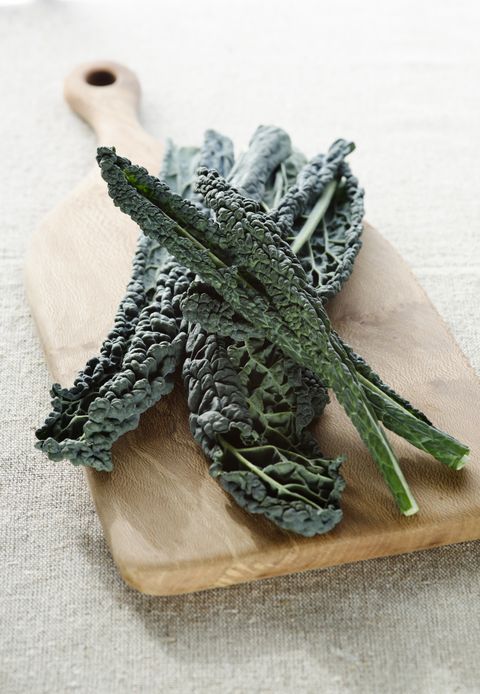 winter vegetables kale on a wooden chopping board