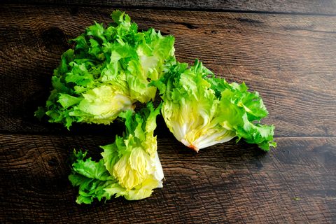 three pieces of green escarole lettuce shown from above