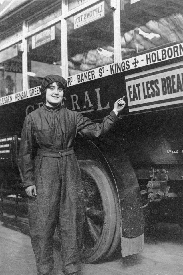 female mechanic pointing to a sign 'eat less bread' on one of her buses, wwi large numbers of women were called to work during the great war to fill the places left my the men and help the war effort photo by daily herald archivenational science  media museumsspl via getty images
