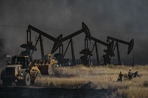 topshot   people battle a blaze next to an oil well in an agricultural field in the town of al qahtaniyah, in the hasakeh province near the syrian turkish border on june 10, 2019   fires have erupted in various parts of syria in recent weeks, with all sides blaming each other for starting them
in the kurdish run breadbasket province of hasakeh, of which al qahtaniya is part, is has claimed several arson attacks on wheat fields photo by delil souleiman  afp        photo credit should read delil souleimanafp via getty images
