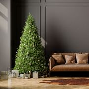 living room interior with christmas tree, gift boxes, brown leather sofa and empty wall