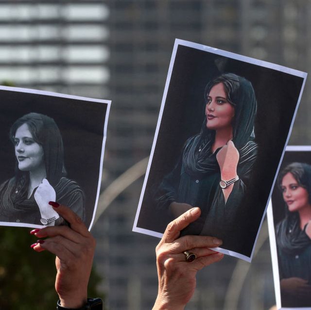 women hold up signs depicting the image of 22 year old mahsa amini, who died while in the custody of iranian authorities, during a demonstration denouncing her death by iraqi and iranian kurds outside the un offices in arbil, the capital of iraqs autonomous kurdistan region, on september 24, 2022   angry demonstrators have taken to the streets of major cities across iran, including the capital tehran, for eight straight nights since the death of 22 year old mahsa amini the kurdish woman was pronounced dead after spending three days in a coma following her arrest by irans feared morality police for wearing the hijab headscarf in an improper way photo by safin hamed  afp photo by safin hamedafp via getty images