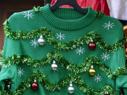 green christmas sweater with decor balls