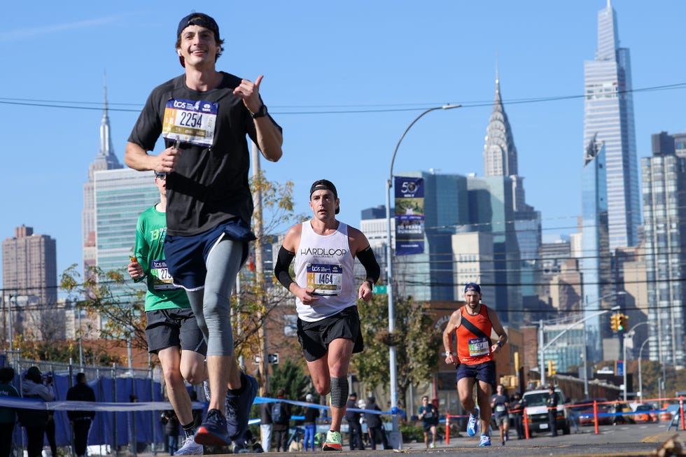 new york, ny   november 07 participants run during the tcs new york city marathon in new york city, united states on november 07, 2021 photo by tayfun coskunanadolu agency via getty images