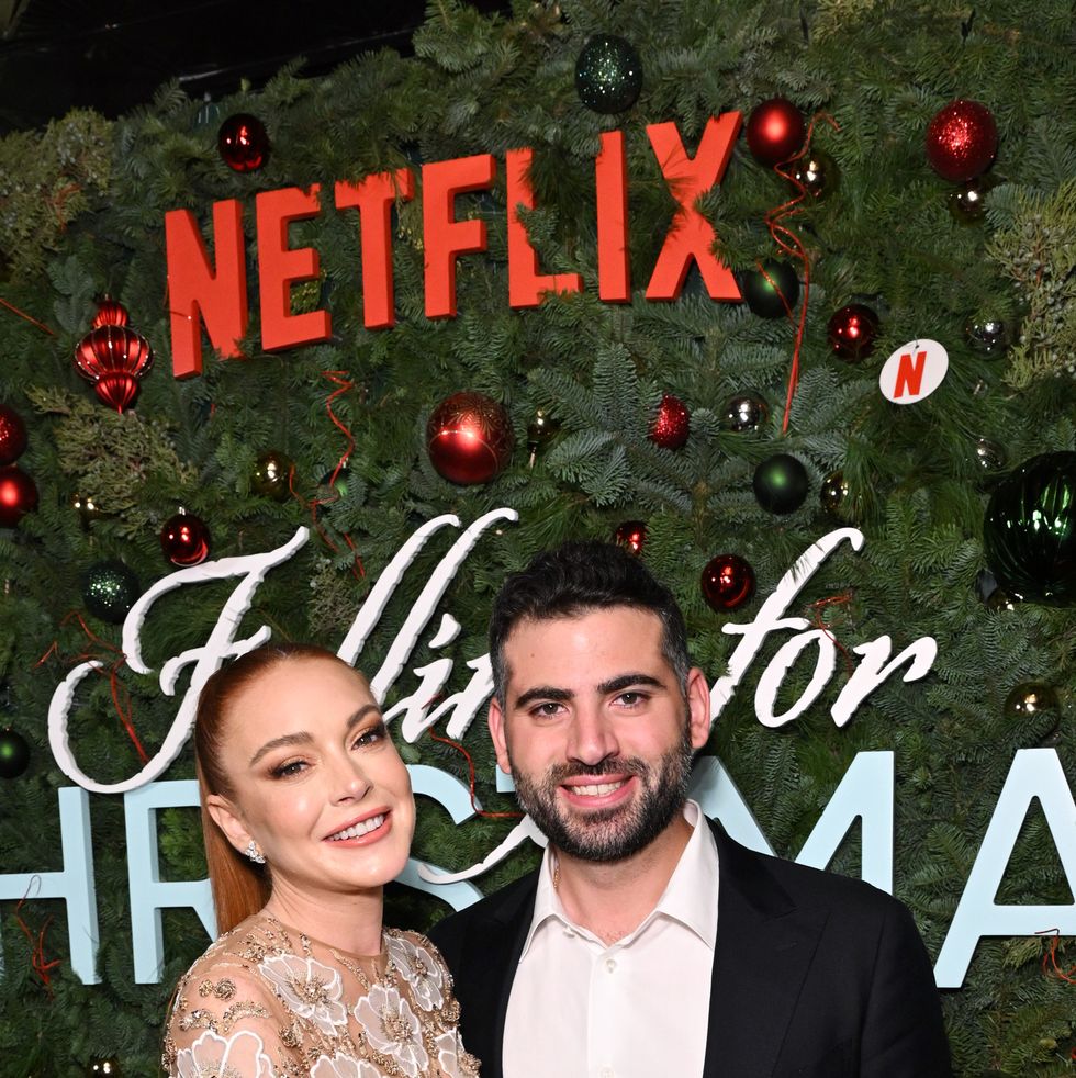 new york, new york   november 09 lindsay lohan and bader shammas attend netflix’s falling for christmas celebratory holiday fan screening with cast  crew on november 9, 2022 in new york city photo by bryan beddergetty images for netflix