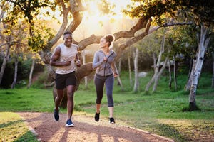 running buddies make every run better and furthershot of a young couple running in nature