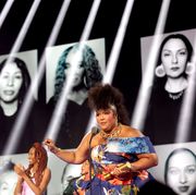 santa monica, california   december 06 2022 peoples choice awards    pictured honoree lizzo r accepts the peoples champion award on stage during the 2022 peoples choice awards held at the barker hangar on december 6, 2022 in santa monica, california     photo by chris polke entertainmentnbc via getty images