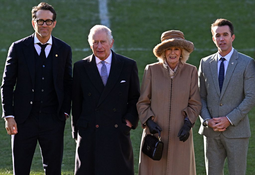 britains king charles iii 2l and britains camilla, queen consort 2r pose for a photograph with wrexham afc co chairman, us actor ryan reynolds l and us actor rob mcelhenney during their visit to wrexham association football club in north wales on december 9, 2022 photo by oli scarff  afp photo by oli scarffafp via getty images