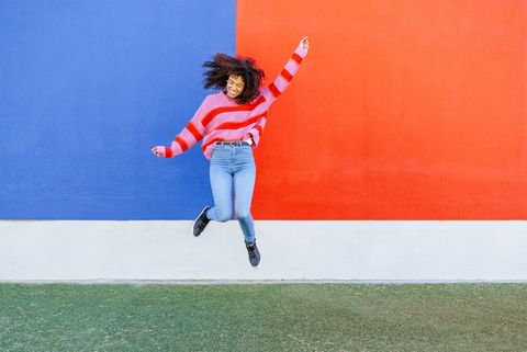 happy young woman jumping in the air