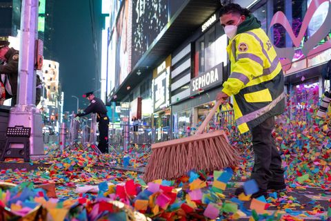 new york, new york january 01 department of sanitation workers clean up confetti and trash after new year’s eve in times square on january 01, 2022 in new york city despite a surge in covid 19 cases new year’s eve happened as planed but with only 15,000 vaccinated participants allowed, who were also required to be masked at all times in an effort to increase safety, people were initially only allowed in beginning at 3 pm on the day of, but were let in earlier people will also be spread out in socially distanced pens last year’s celebration allowed no spectators due to the coronavirus pandemic photo by alexi rosenfeld getty images