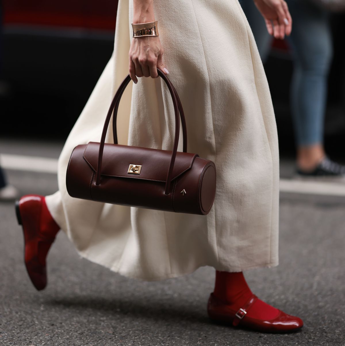 a person wearing a brown purse