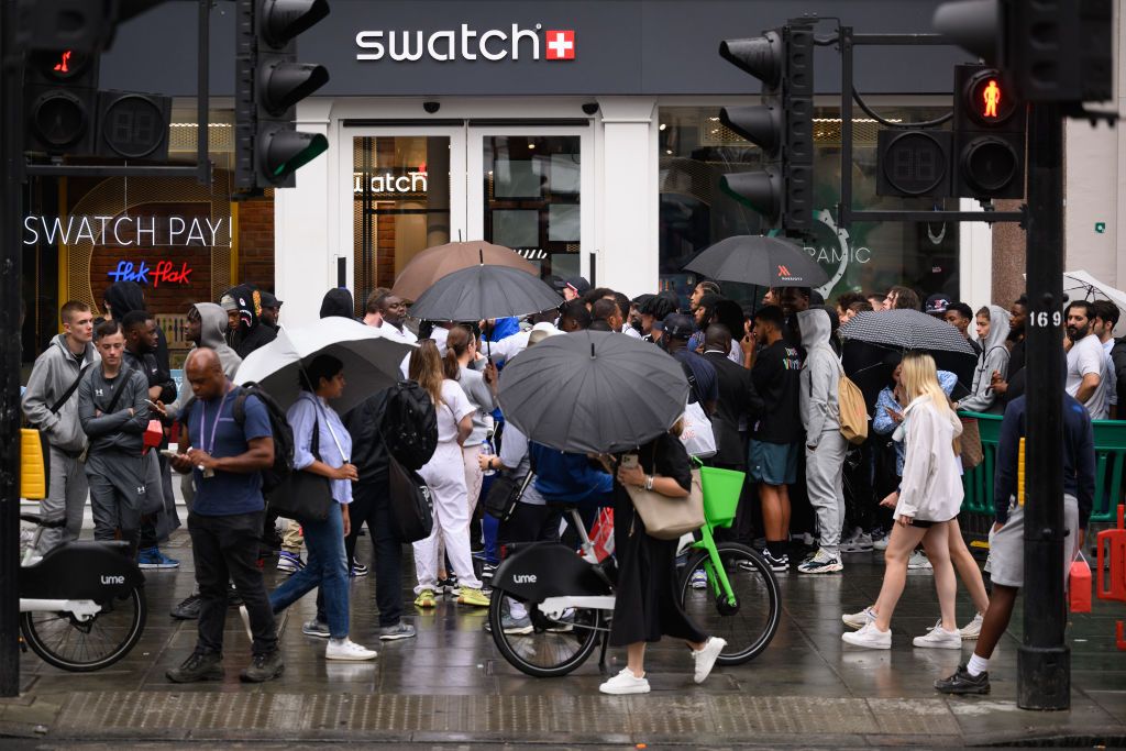 london, england august 16 a large group of people gather outside the swatch store as a new supply of the omegaswatch moonswatch goes on sale on august 16, 2022 in london, england the collaboration between the two brands has seen only limited amounts released, with no online sales, resulting in a big market for resale profit making for those who manage to find any available for sale on its release, examples of the ceramic watch were selling online for more than £3000, despite a retail price of only £207 a huge boom in watch value appreciation over recent years has seen price bubbles appear such as this, where people see the opportunity for vast profits photo by leon nealgetty images