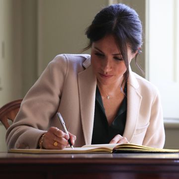 chichester, england october 3 meghan duchess of sussex signs the visitors book at edes house during an official visit to sussex on october 3, 2018 in chichester, england the duke and duchess married on may 19th 2018 in windsor and were conferred the duke duchess of sussex by the queen photo by daniel leal olivas wpa poolgetty images