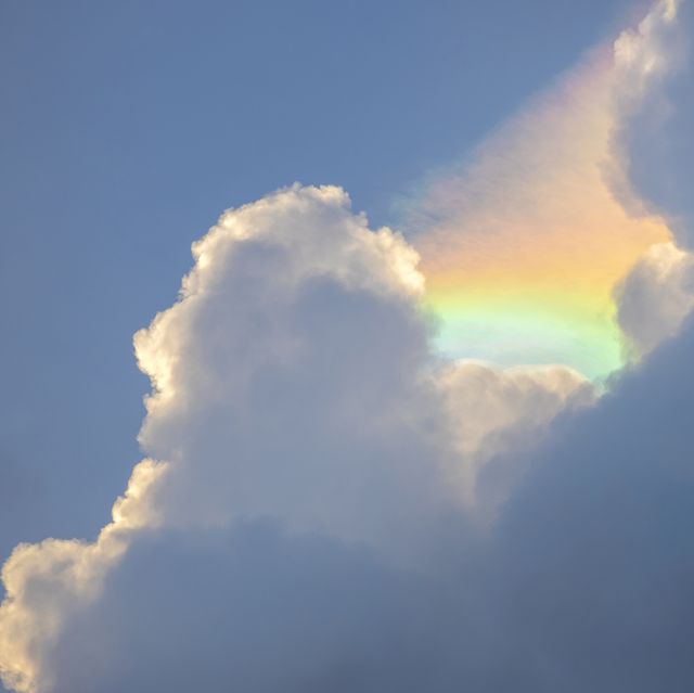 iridescent clouds formed between cumulus cloud in late afternoon in eastern side of singapore