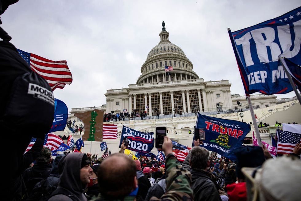 washington, dc january 06 pro trump supporters storm the us capitol following a rally with president donald trump on january 6, 2021 in washington, dc trump supporters gathered in the nations capital today to protest the ratification of president elect joe bidens electoral college victory over president trump in the 2020 election photo by samuel corumgetty images