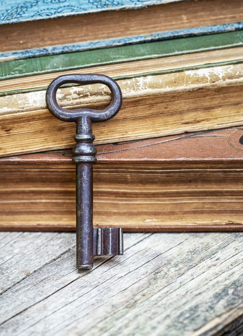 vintage old key and antique books, escape room game concept