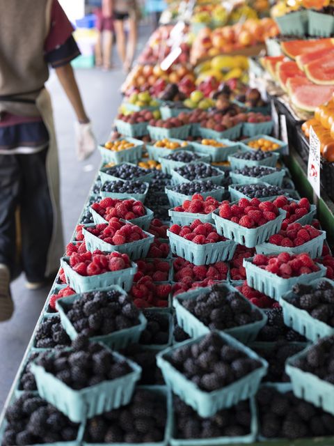 fresh organic raspberries on stall for sell in marketplace