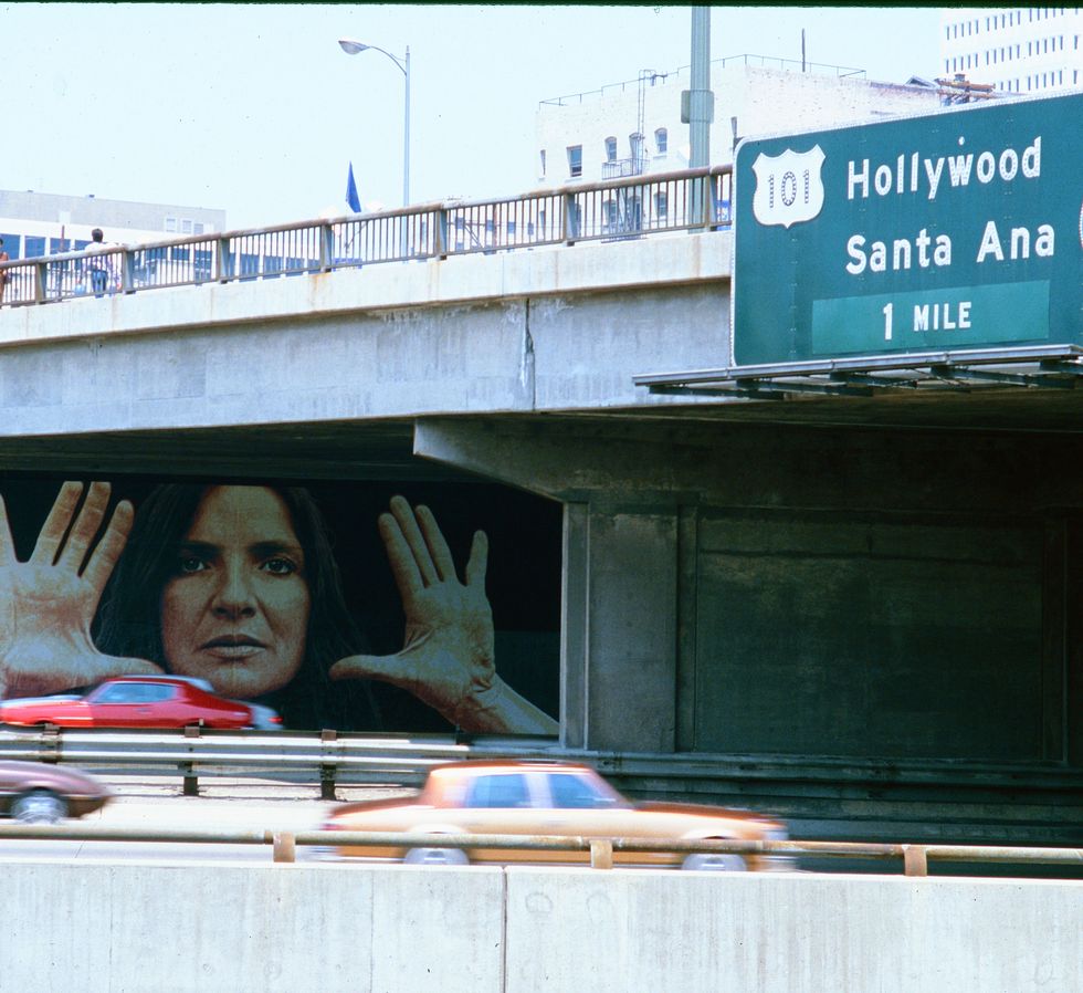 freeway mural artist kent twitchel depicts abstract mythical painter lita albuquerque on the west side of the harbor freeway at seventh street for olympic arts festival, los angeles, ca july 1984 photo by ben martingetty images