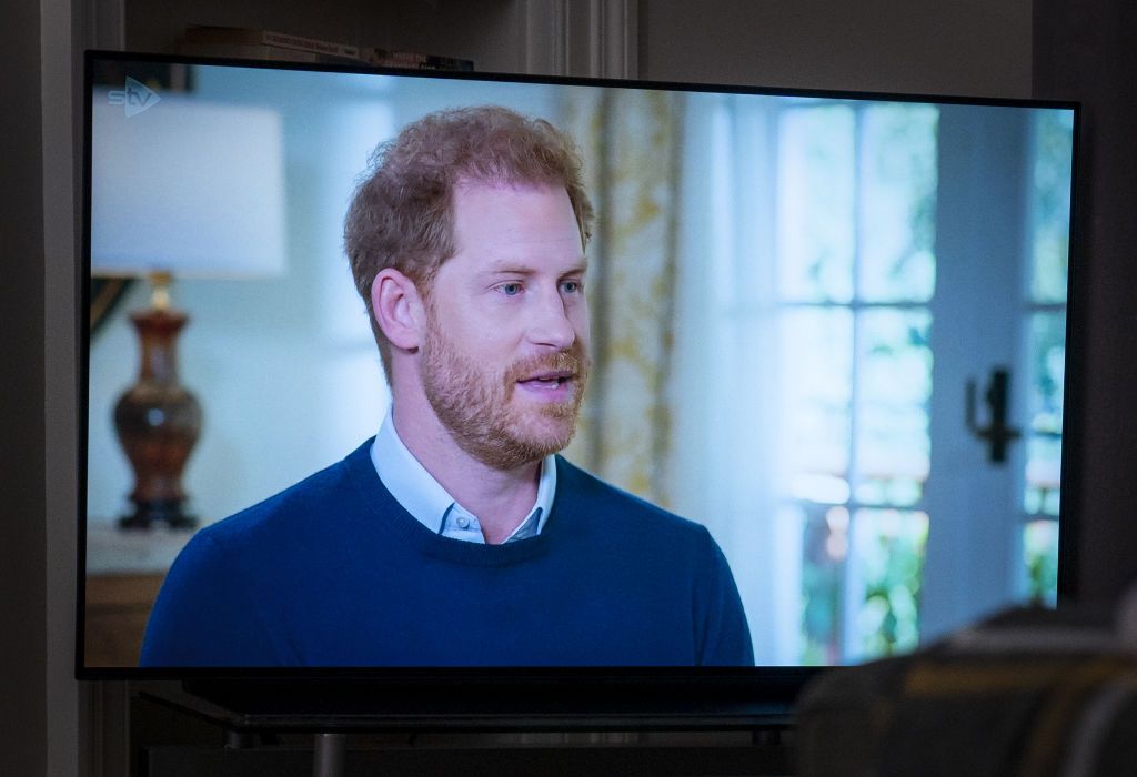 a person at home in edinburgh watching the duke of sussex being interviewed by itvs tom bradby during harry the interview, two days before his controversial autobiography spare is published picture date sunday january 8, 2023 photo by jane barlowpa images via getty images