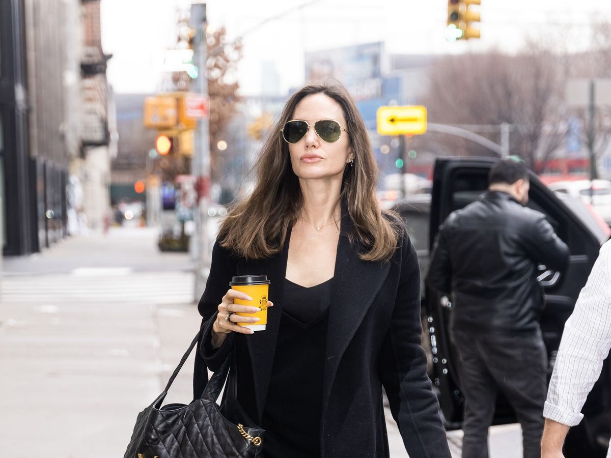 WHAT SHE WORE: Angelina Jolie in black polka dot sheer blouse with black  pants and black leather tote bag in Sydney on September 29 ~ I want her  style - What celebrities