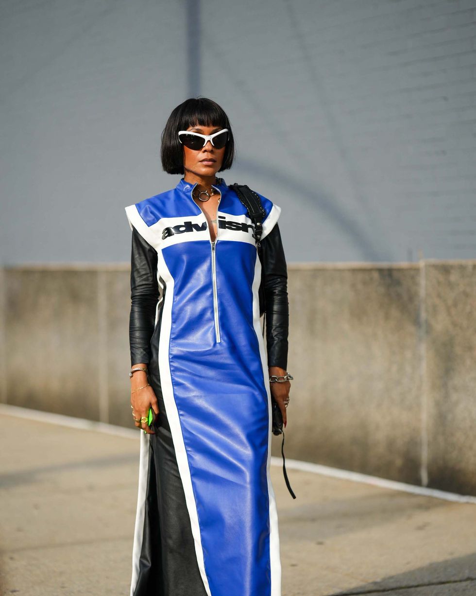 new york, new york september 10 a guest wears sunglasses, a blue and black leather long coat with shoulder pads, outside ndigo, during new york fashion week, on september 10, 2023 in new york city photo by edward berthelotgetty images