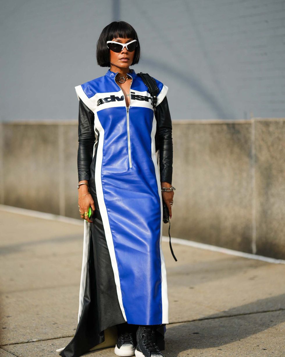 new york, new york september 10 a guest wears sunglasses, a blue and black leather long coat with shoulder pads, outside ndigo, during new york fashion week, on september 10, 2023 in new york city photo by edward berthelotgetty images