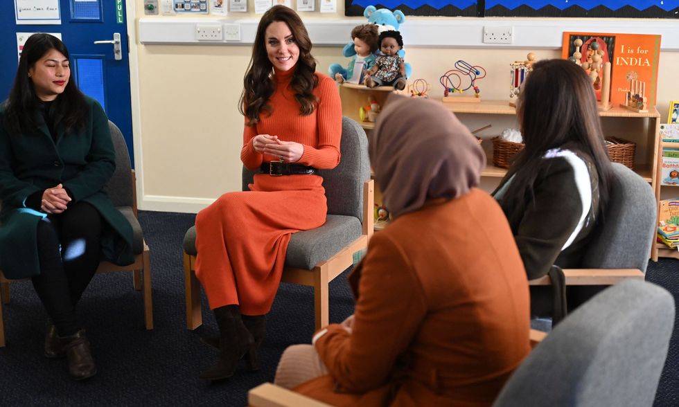 britains catherine, princess of wales 2l talks with parents during her visit to foxcubs nursery in luton, north of london on january 18, 2023, as part of her ongoing work to elevate the importance of early childhood to lifelong outcomes photo by justin tallis pool afp photo by justin tallispoolafp via getty images