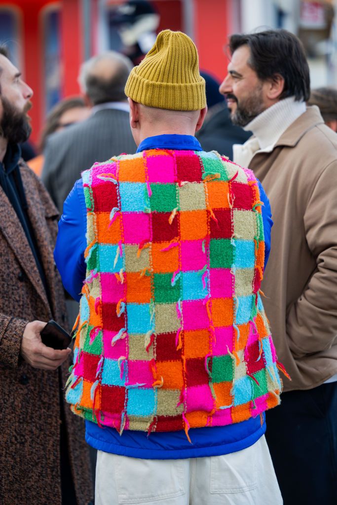 florence, italy january 12 matteo marucci wears colorful checkered vest, beanie at fortezza da basso on january 12, 2023 in florence, italy photo by christian vieriggetty images