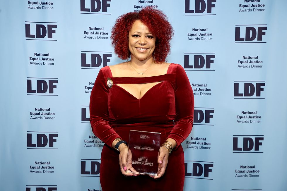 new york, new york may 10 honoree nikole hannah jones poses with the spirit of justice award backstage during the ldf 34th national equal justice awards dinner on may 10, 2022 in new york city photo by arturo holmesgetty images for legal defense fund