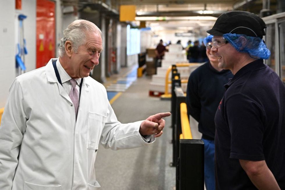britains king charles iii l speaks to staff on the cornflakes production line during a visit to the headquarters of cereal manufacturer kelloggs marking its 100th anniversary in manchester, north west england, on january 20, 2023 kelloggs is the largest cereal factory in europe and biggest corn flake factory in the world the manufacturer has been a holder of the royal warrant since the reign of king george vi and cereal from the business was historically delivered to buckingham palace in a small van called genevieve photo by paul ellis pool afp photo by paul ellispoolafp via getty images