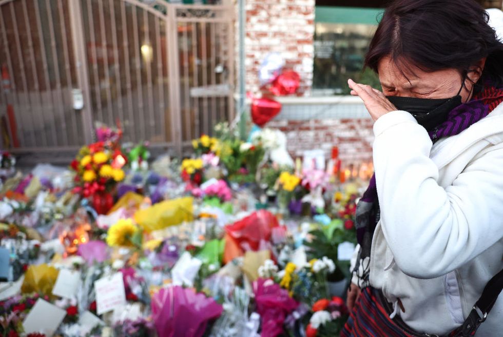 monterey park, california january 25 a person reacts while visiting the memorial outside the star ballroom dance studio where a deadly mass shooting took place on january 25, 2023 in monterey park, california eleven people died and nine more were injured at the studio near a lunar new year celebration last saturday night us vice president kamala harris visited the memorial and was scheduled to meet with families of victims in the predominantly asian american community of monterey park photo by mario tamagetty images