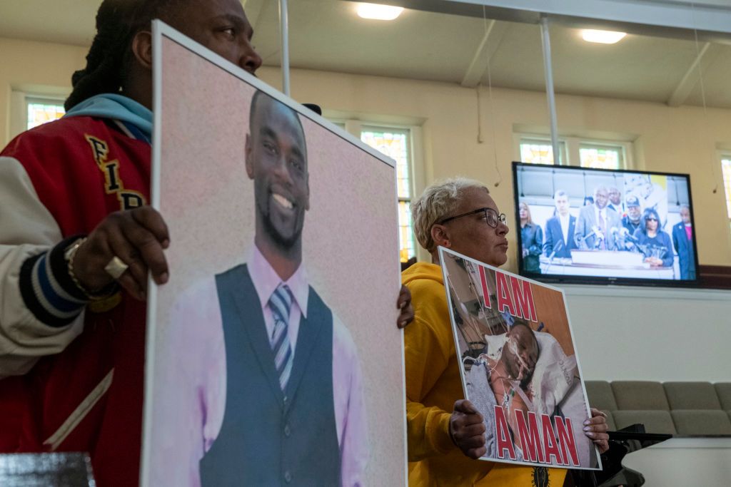 memphis, tn january 23 activists hold signs showing tyre nichols as attorney ben crump is seen speaking on a monitor during a press conference at mt olive cathedral cme church addressing video footage of the violent police encounter that led to nichols death in memphis, tn on january 23, 2023 photo by brandon dill for the washington post via getty images